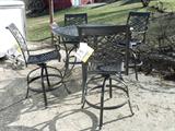 New with tags high top patio table with four high top chairs.