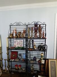 Iron bakers racks as well as many brass candlesticks, vintage doll and other collectibles