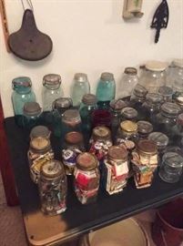 Antique canning jars & old canning jars filled with paper match books, wood sewing spools and keys