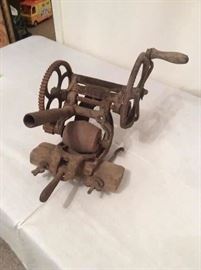 Antique McCormick-Deering stone sickle grinder.