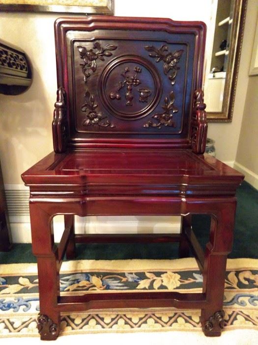 Close-up of the hand carved Chinese mahogany chairs.