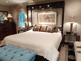 Unique and extra-special king sized mahogany bed, hand painted Asian art on silk above the bed, pair of vintage brass/glass nightstands, pair of lamps with suede shades, pair of blanc de chine figurines, tufted blue & white stool. 
