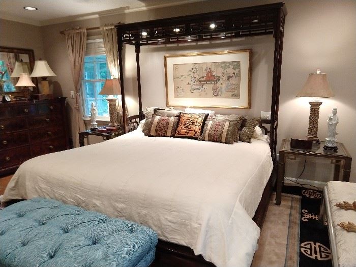 Unique and extra-special king sized mahogany bed, hand painted Asian art on silk above the bed, pair of vintage brass/glass nightstands, pair of lamps with suede shades, pair of blanc de chine figurines, tufted blue & white stool.