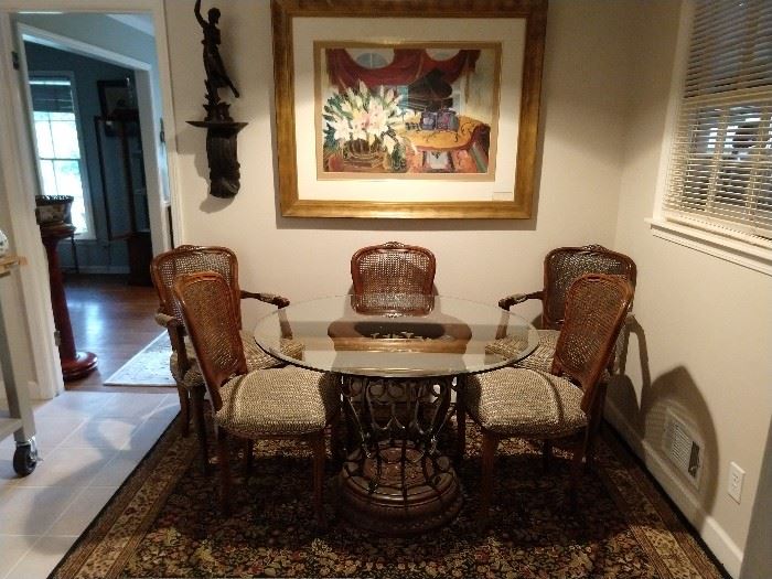 Round, beveled glass topped breakfast able, with set of six French chairs, cane back/upholstered seats - two arms & four sides. Art is by Raschella Collection.