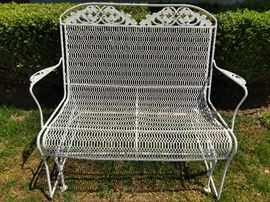Vintage wrought iron glider, freshly painted for your spring pleasure. 