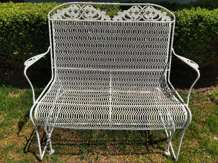 Vintage wrought iron glider, freshly painted for your spring pleasure.
