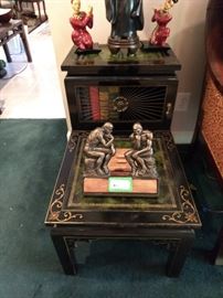 Lovely vintage bi-level end table, with black lacquer finish, gold detail, metal grid and tooled green leather top.