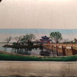 Nicely executed woven tapestry of an Asian temple on a lake, measures 5' 8" x 17".