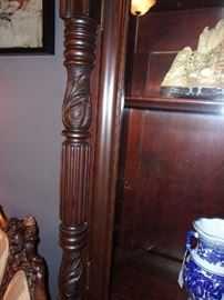 detail of carved pilasters on the display/bookcase