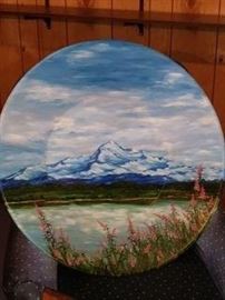 Mount McKinley In Alaska  artist hand painted on a pan used to pan for Gold. Title "Fireworks on the 4th of July" comes with a oak wall mount shelve to hold plate.
