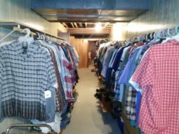 25 feet of men's clothing shirts, polo's, a lot brand new with tags still on