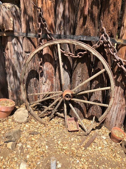 TONS OF ANTIQUE YARD ART!, WAGON WHEELS, WINDMILL, FIRE STATION HOSE REEL, COW SKULL, PETROFIED WOOD & MORE!