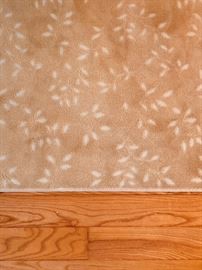 LR carpet with cream cutout leaves and pad;  10' x 14