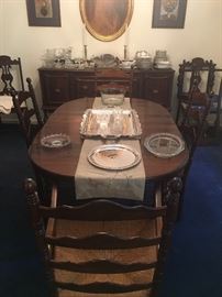Vintage farmhouse table with three leaves with ladder back chairs with rush bottoms
