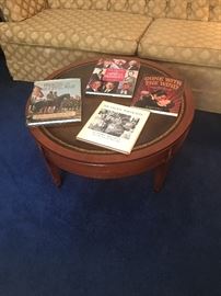 Round Empire leather topped table with coffee table books