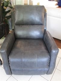 Rocker/Recliner "Signature Design" by Ashley, charcoal color. So new it still has the tags on it.