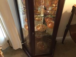 Carnival glass collection in lighted curio cabinet