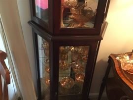 Carnival glass collection in lighted curio cabinet