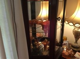 Carnival glass collection in lighted curio cabinet