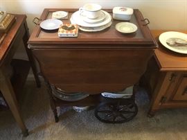 Vintage wooden tea cart with miscellaneous devor items