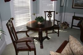 Vintage Round Mahogany table with two wing chairs