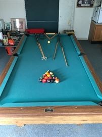 Full Brunswick pool table with accessories.  Ping pong table top available as well.