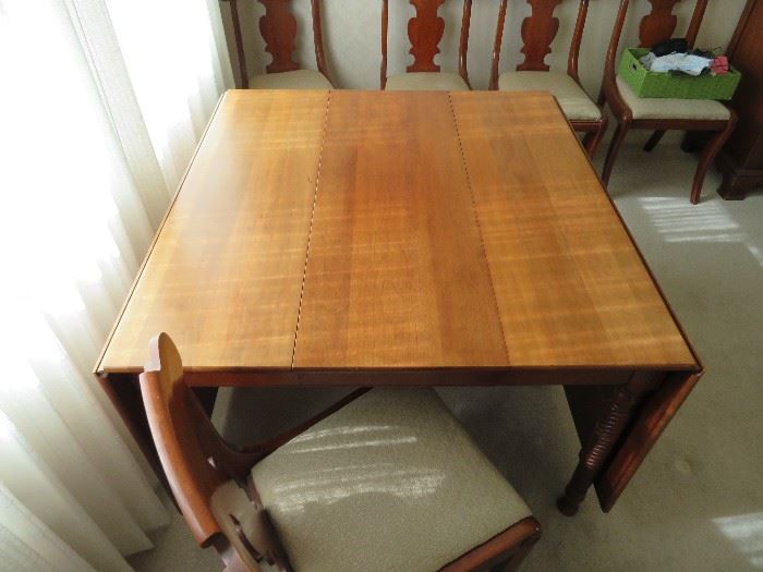 Beautiful Cherry  Table with leaf and 2 sets of pads  and 6 sturdy chairs 