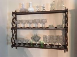 Small wooden shelf with decorative glass pieces