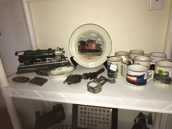 N & W collectables including locks, cups, etc. The Train Engine is a telephone.