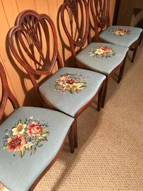 There are six of these needlepoint seats.  The chairs are not in such good condition.