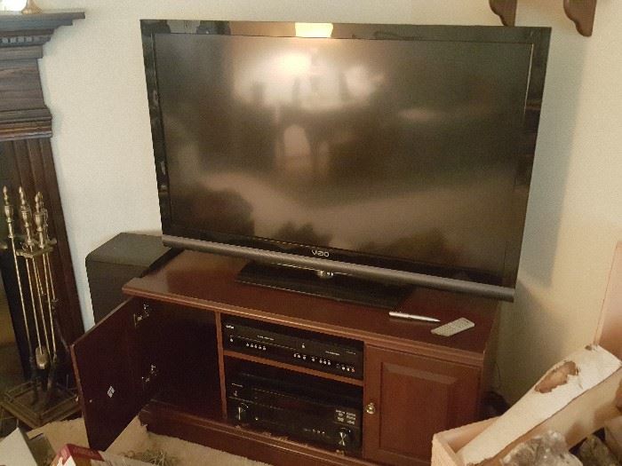 Vizio TV, components, and Stand. Fireplace tools set.