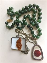 Jade beads and reverse side of pendants