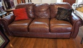 One, of 2, leather sofas