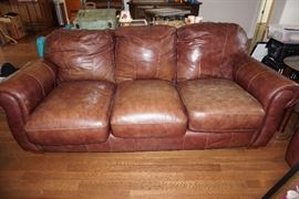 One, of 2, leather sofas