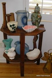 Small endtable with variety of Pottery 