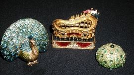 Lot of Estee Lauder miniature figural solid perfume compacts.