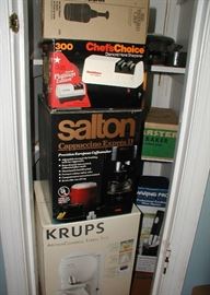 Boxed/new kitchen items: Krups Aroma Control coffee maker, Salton Cappuccino coffee maker, Chef's Choice knife sharpener, Waffle Maker, Wine Opener..etc.