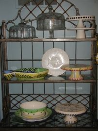 Baker's rack, loaded with cake stands and cake plates