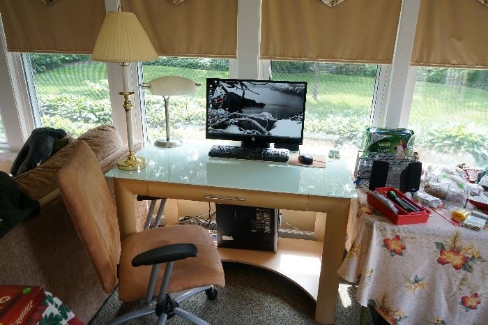 Glass top computer desk with  drop down drawer.