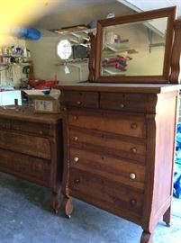 Two 100+ year old chests. The one on the right has a mirror and the left one has a frame for a mirror. There are extra knobs in the drawers. 