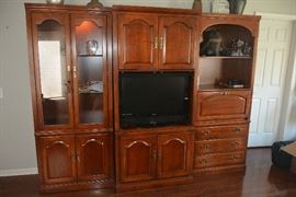 Beautiful cherry Thomasville wall unit. 3 separate units. Also includes doors for tv area.