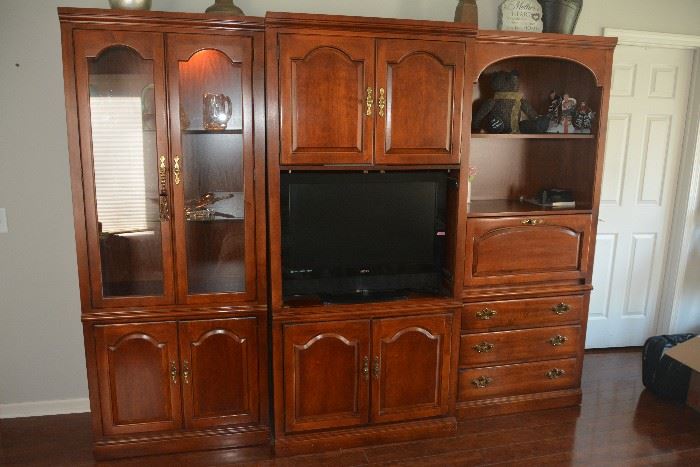 Beautiful cherry Thomasville wall unit. 3 separate units. Also includes doors for tv area.