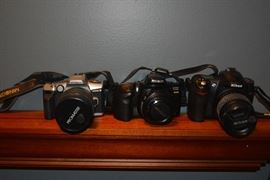 Nikon D50, Minolta Maxxum 450si, Minolta Maxxum 5, with lenses.