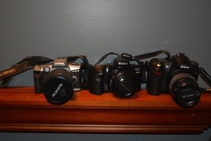 Nikon D50, Minolta Maxxum 450si, Minolta Maxxum 5, with lenses.