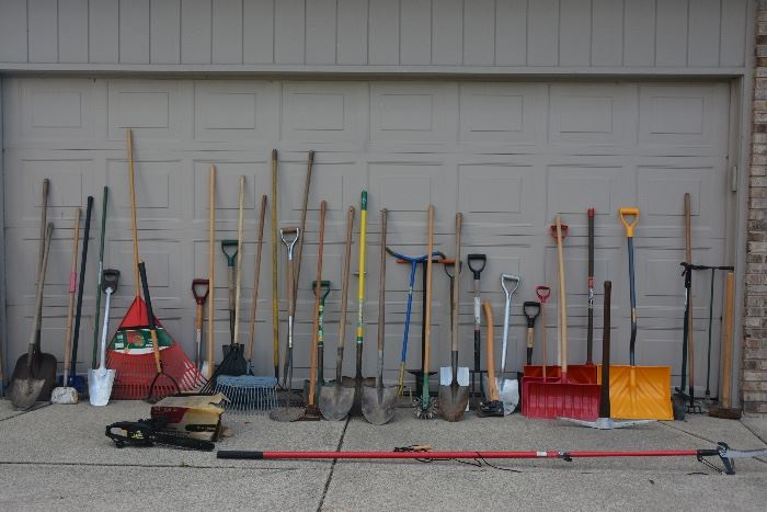 A wide array of outdoor tools, including an electric chain saw and tree limb clipper. There is a LOT more items in the garage too.