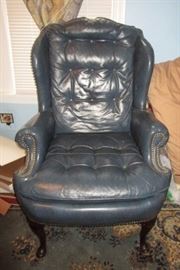 1 of 2 blue leather wing back chairs
