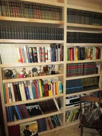 Library full of vintage and modern books, several sets of books including Harvard Classics