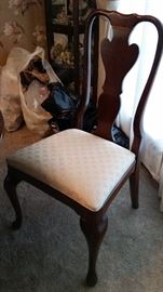One of 6 split back chairs for the formal dining room set .