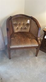 Tufted velvet cane accent chair.