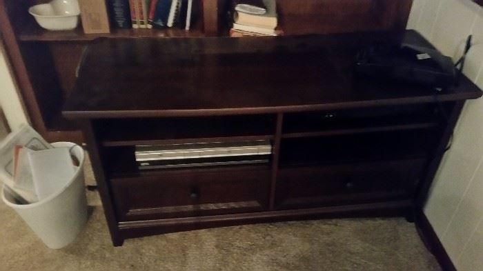 TV cabinet with open shelving for other electronic  equipment. 